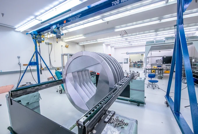 Mu2e tracker planes being fabricated in a clean room, these are used to detect electrons and muons at very high sensitivities. https://news.fnal.gov/2022/03/straws-crystals-and-the-quest-for-new-subatomic-physics/