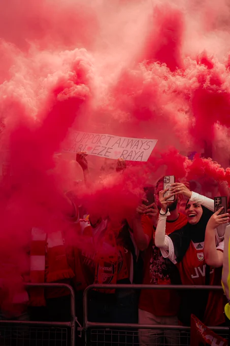 Arsenal supporters celebrate the Premier League title at the parade.