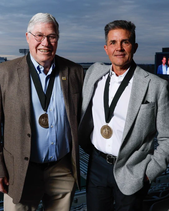 Mark Kaufman (right) honors mentor Ed Crowley with support for athletic training at Iowa.