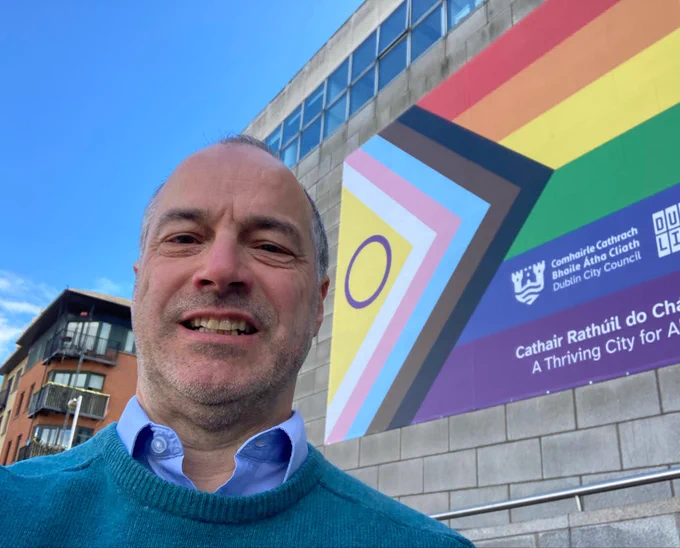 Pic of me with large Pride flag on Dublin City Council HQ