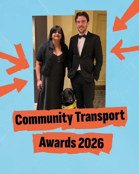 A picture of two people in a hotel dressed in evening wear smiling at the camera. A black labrador is between them. The image is in a jagged frame on a blue textured background with bright orange arrows. Bold black text on orange tape underneath the image says "Community Transport Awards 2026"