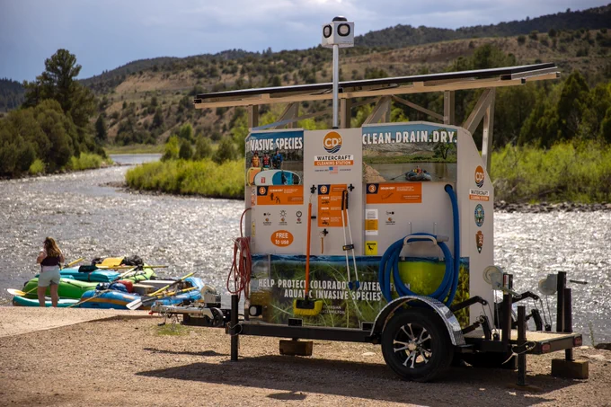 Rafting in Colorado near a cleaning station to help protect against aquatic invasive species.