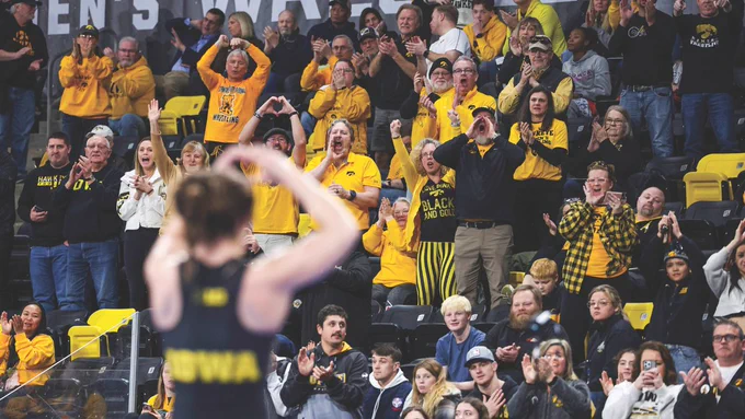 Lilly Luft thanks Hawkeye women’s wrestling fans for their support during the inaugural NCAA women’s wrestling championships at Xtream Arena in Coralville. Iowa finished second, and three Hawkeyes—Valarie Solorio, Kennedy Blades, and Kylie Welker—earned individual titles.