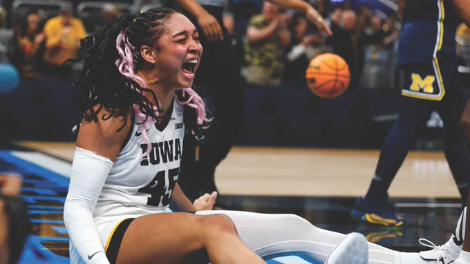 During the Big Ten Tournament semifinals, Iowa forward Hannah Stuelke (26BA) celebrates making a basket and drawing a foul against Michigan. The Hawkeyes won 59-42 and punched their 10th ticket to the Big Ten championship game.