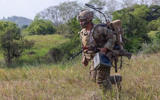 A U.S. Soldier assigned to the 3rd Mobile Brigade, 25th Infantry Division, maneuvers toward an objective while carrying a tactical radio during platoon live fire training as part of Salaknib 2026 at Fort Magsaysay, Nueva Ecija, Philippines, May 28, 2026.