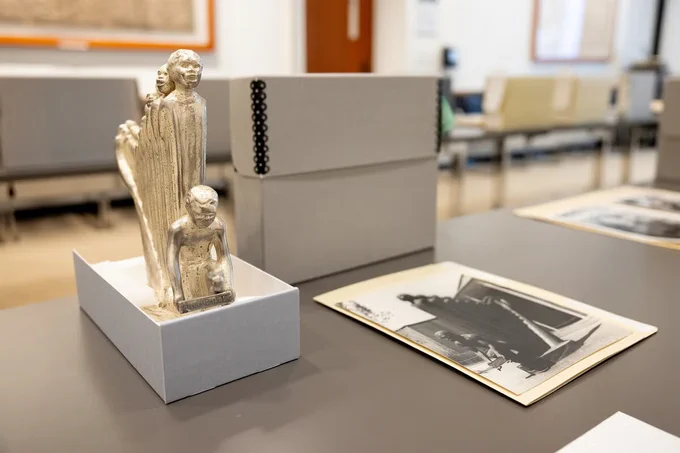 Archival materials and statue.