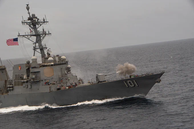 Arleigh Burke-class guided-missile destroyer USS Gridley (DDG 101) fires a Mark 45 Mod 4 5-inch naval gun during a naval power demonstration as part of a distinguished visitor tour aboard Nimitz-class aircraft carrier USS Nimitz (CVN 68) in the Caribbean Sea, June 7, 2026. Nimitz is deployed as part of Southern Seas 2026 which seeks to enhance capability, improve interoperability, and strengthen maritime partnerships with countries throughout the region through joint, multinational and interagency exchanges and cooperation. (U.S. Navy photo by Mass Communication Specialist Seaman Johnathan McCune)
