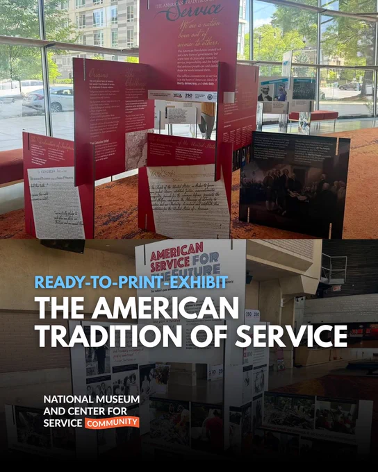 The image shows an exhibit titled "The American Tradition of Service," located at the National Museum and Center for Service. The exhibit features a series of red and blue panels with text, images, and historical documents, displayed in a well-lit room with large windows.