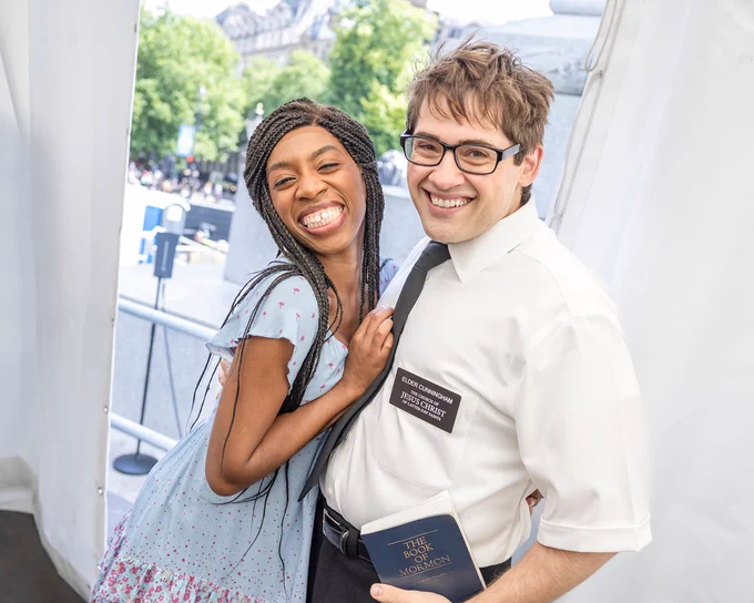 The cast of The Book Of Mormon hugging and smiling backstage at West End LIVE.