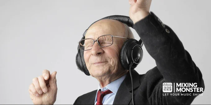 Senior man enjoying music with headphones, expressing happiness and energy.
