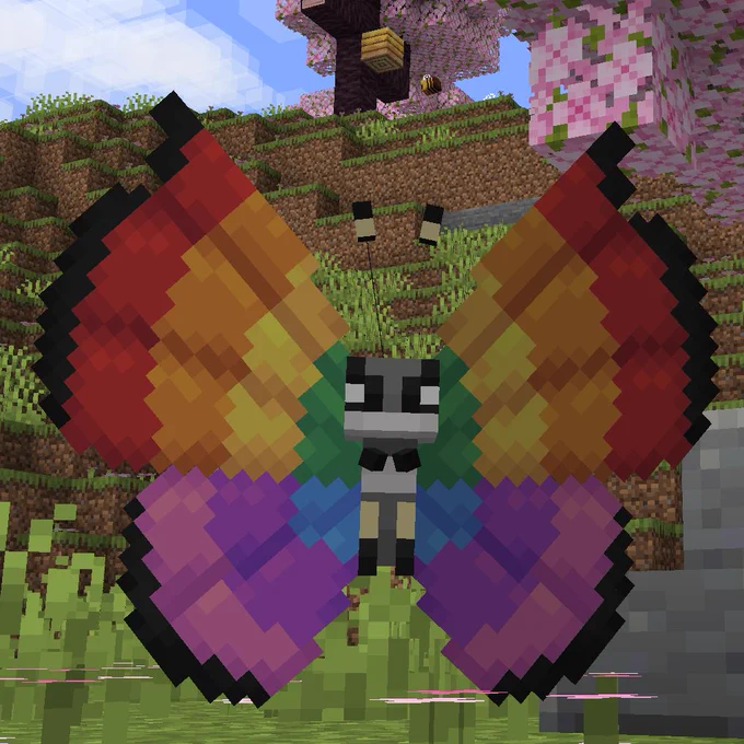 The cobblemon Vivillion is in a cherry grove with rainbow wings.