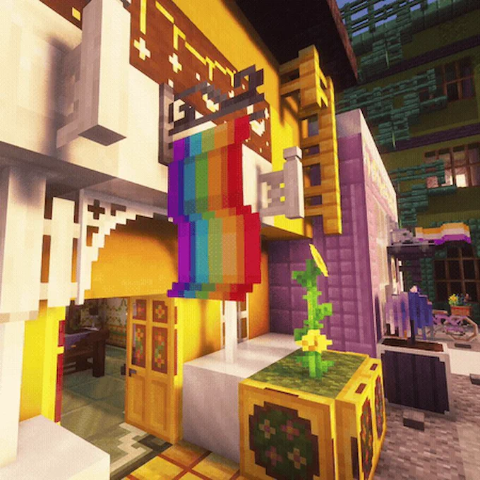 A Minecraft scene shows the entrance to a building with a rainbow flag hung over the doorway.