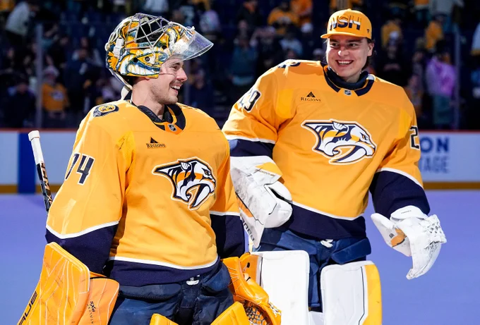 Photo of Juuse Saros and Justus Annunen smiling