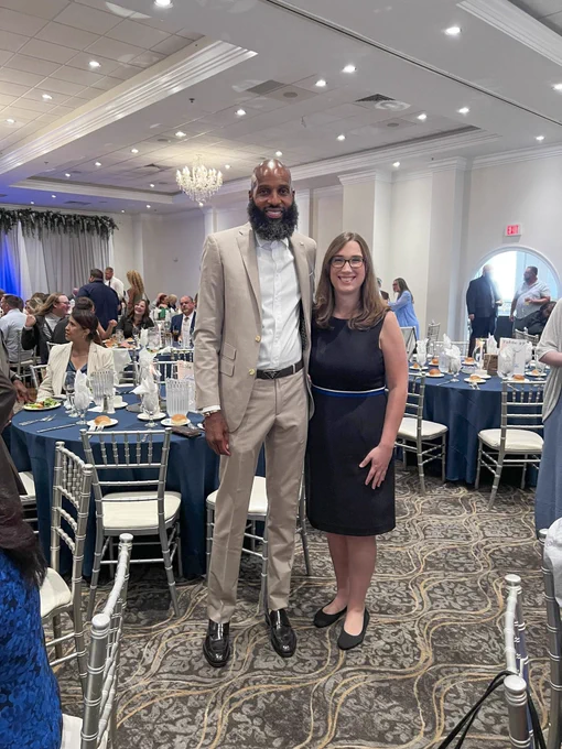 Rep. McBride poses with an attendee inside of the banquet hall at the Building Construction Trades banquet. 
