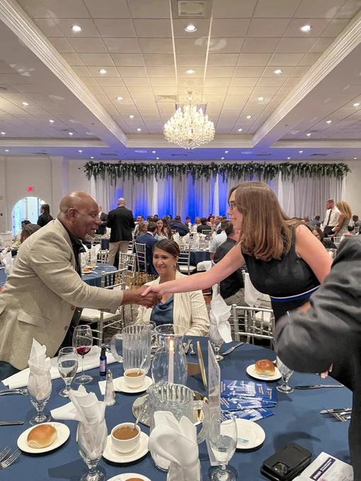 Rep. McBride shakes an attendees' hand at the Building Construction Trades Banquet. 