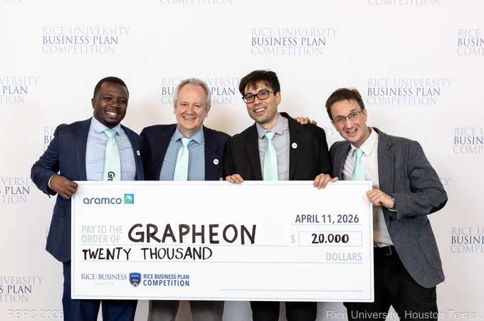(L - R): Aime Laurent Twizerimana, Götz Veser, Nader Sawtarie, and Christopher Wilmer holding an Aramco prize check for $20,000.