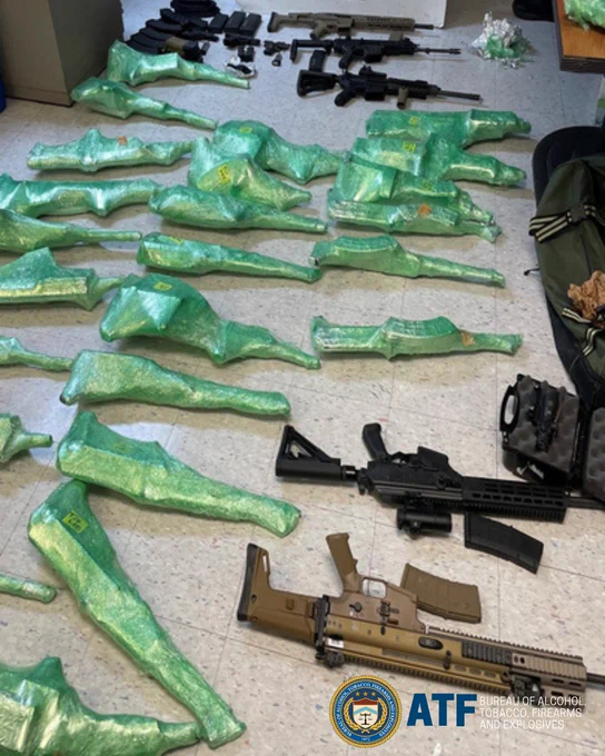 Multiple firearms from this case, many wrapped in green bubble wrap, laid out on the floor. Image courtesy of U.S. Attorney's Office, Western District of Texas.