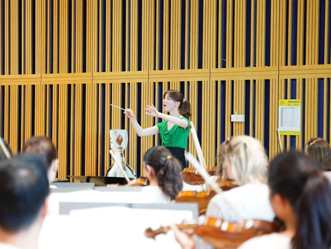 RPS Conductor Josephine Korda conducting the Royal Northern Sinfonia