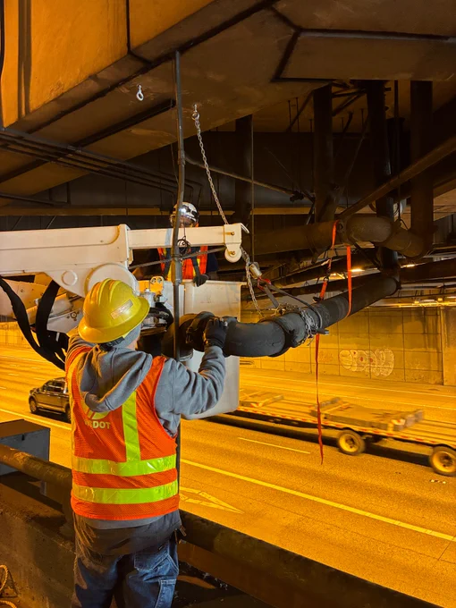 WSDOT maintenance crews doing pipe work under the Seattle Convention Center. 