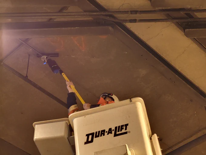 WSDOT maintenance crews doing overhead work under the Seattle Convention Center. 
