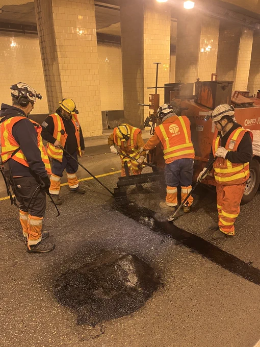 WSDOT maintenance crews doing mastic paving work. 