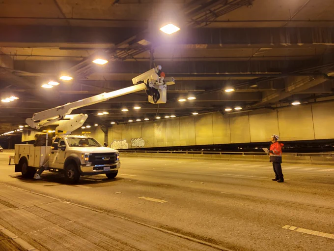 WSDOT maintenance crews doing overhead work under the Seattle Convention Center. 