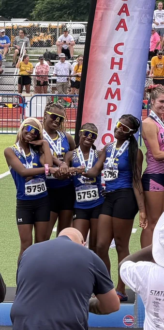 RGHS Lady Rams 4x1 relay team post on the podium