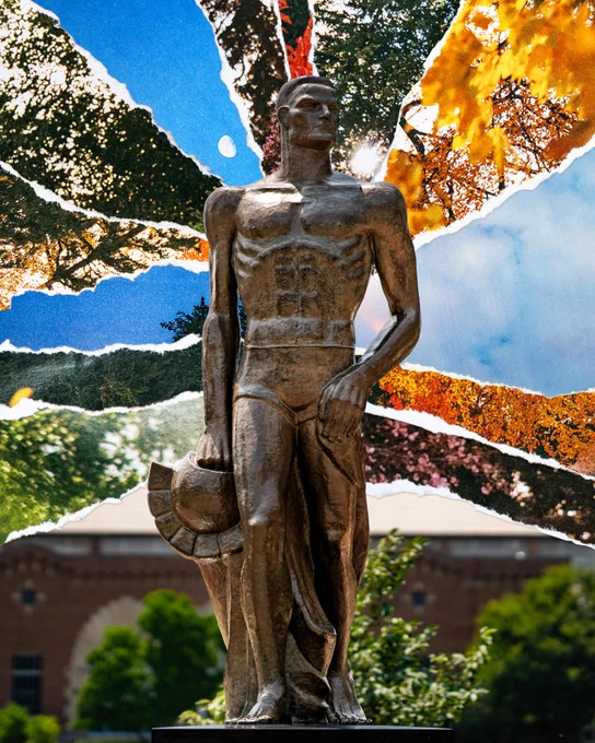 Spartan Statue on MSU campus, standing against a vibrant collage. The background features blue skies with a moon, green trees, and bright orange autumn foliage, with sun glare peeking through.