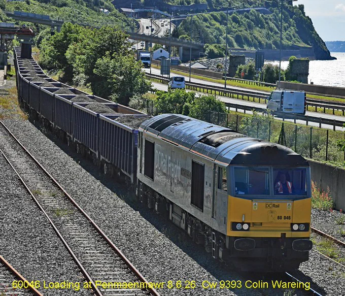 60046 Loading at Penmaenmawr 8.6.26 to form 6A26      
         
DCR locomotive no 60046 is at the head of a stone train being loaded at Penmaenmawr on the North Wales coast on Monday 8.6.2026.
Once the train is loaded it will have around 2000 tonnes of stone with in the wagons that has come from the nearby quarry. 
The train left here just before 20.00 hrs and will travel over night to a rail head in Quainton in Buckinghamshire where the stone will be unloaded and be used on the construction of HS2.  
DCR is DC Rail, a rail freight company providing mainly bulk services for construction, energy and manufacturing across the UK. 
The locomotive, 60046 carries the name “Willliam Wilberforce” 
It is running under the head code or train reporting no 6A26. 
8.6.26 
Image Cw 9393 copyright Colin Wareing of Colin and Carole’s Creations
