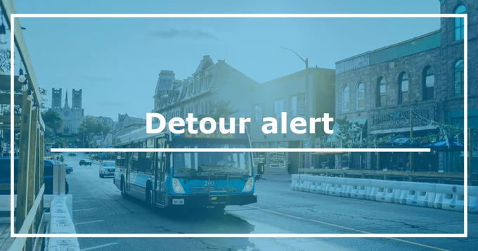 Image shows a bus driving with words “detour alert” are over the image. 