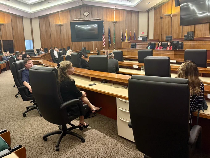 Oakland Co clerks seated in council chambers with AG Nessel and Deputy SOS Edevbie
