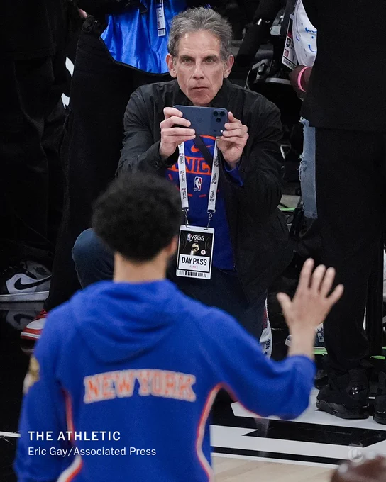 Ben Stiller films a Knicks player using his iPhone.