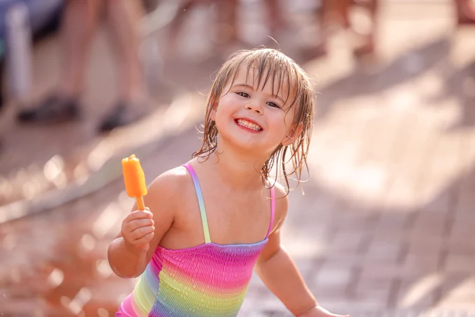 A kid enjoying a popsicle. 