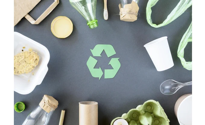 Image of plastic and carton packaging surrounding a recyclable symbol.

Image provided by Freepik.