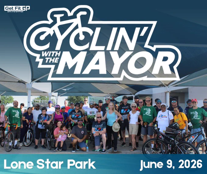 Group of cyclists and community members gathered under shade at Lone Star Park promoting Cyclin' with the Mayor event on June 9, 2026.