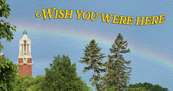 A postcard-style image features a colorful rainbow arcing over a lush landscape with tall trees. A red brick tower with a dome is visible on the left. The words "WISH YOU WERE HERE" are written in bold yellow letters at the top.