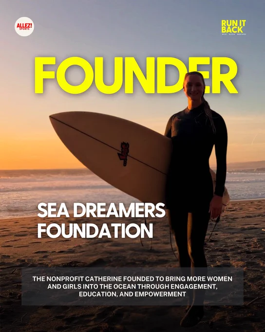 Catherine Breed in a black wetsuit holding a white surfboard with red graphic, standing on a beach at sunset with golden orange sky and crashing waves behind her. Bold yellow text: "FOUNDER." White text below: "SEA DREAMERS FOUNDATION." Subtext on the nonprofit bringing more women and girls into the ocean through engagement, education, and empowerment.