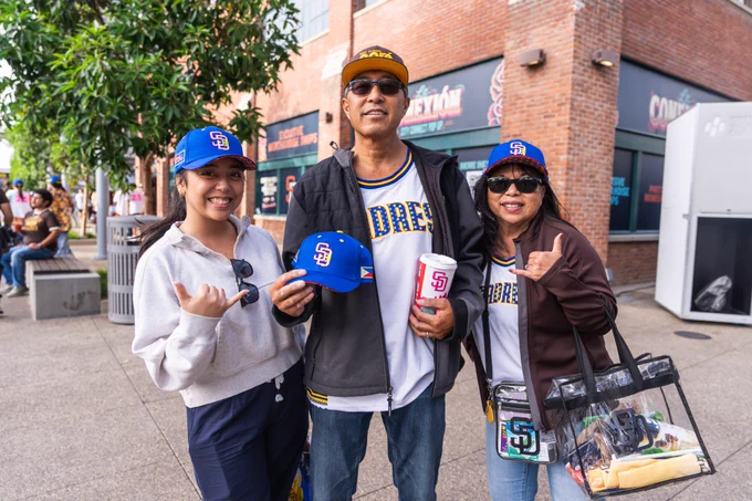 Fans smiling at the camera for Filipino Heritage Celebration.