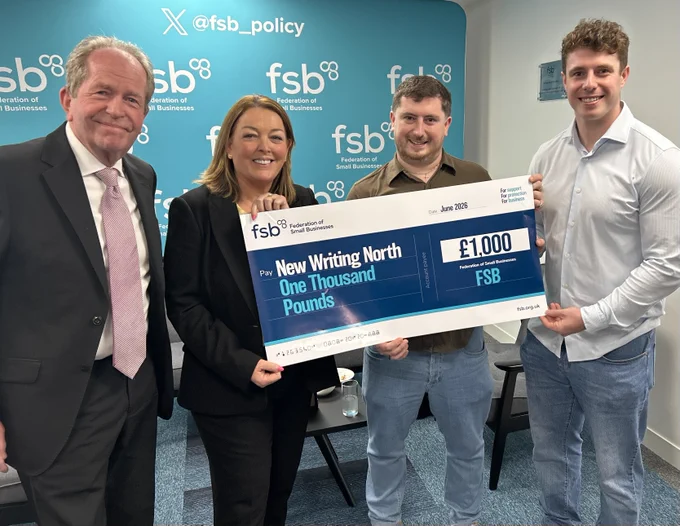 FSB National Chair Martin McTague and Policy Chair Tina McKenzie presenting a cheque for New Writing North to Neil Warwick's sons Richard and Sam.