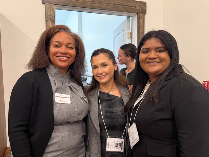 Acting State Comptroller Shirley U. Emehelu poses for a photo with two students at a Center for American Women and Politics event.
