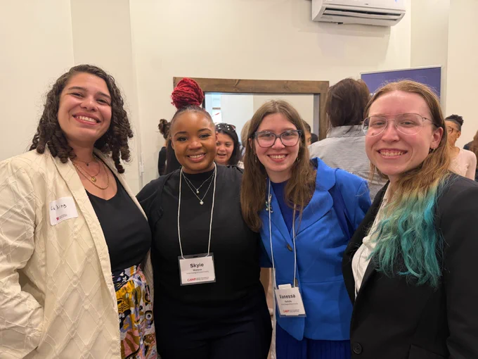 New Jersey Office of the State Comptroller Chief Operating Officer Kia King poses for a photo with New Jersey students at a Center for American Women and Politics event.