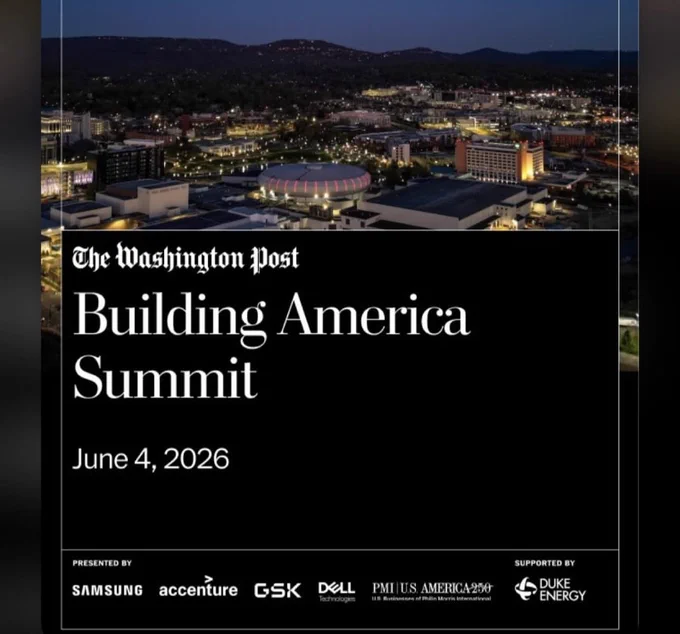 Aerial night view of a cityscape with illuminated buildings and hills in the background for the Building America Summit event.