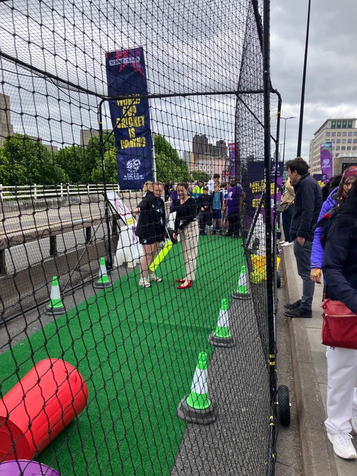 Minister Peacock hitting a cricket ball