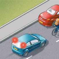 Image of a cyclist passing a parked car.