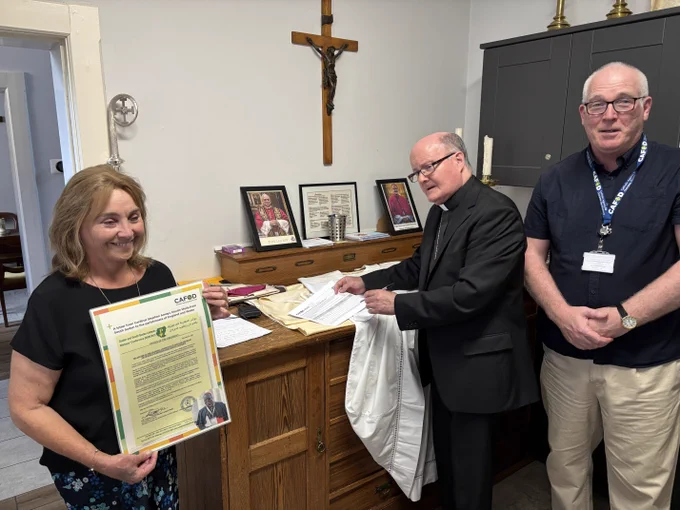 Bishop Patrick McKinney from the Diocese of Nottingham signing the CAFOD debt petition. 