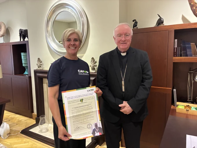 Bishop Philip Egan from the Diocese of Portsmouth signing the CAFOD debt petition. 