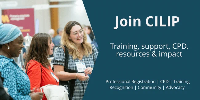 Group of professionals networking at a conference promoting CILIP membership benefits.