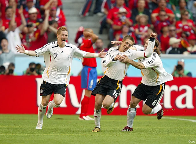 Germany players Schweinsteiger, Lahm and Frings celebrate a goal