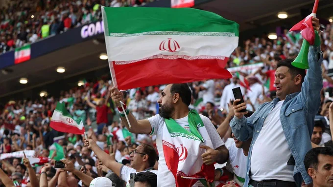 Iranian football fans in a packed stadium