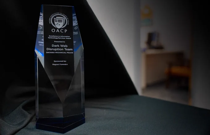 OACP Excellence in Information Technology Services Award sits on table 